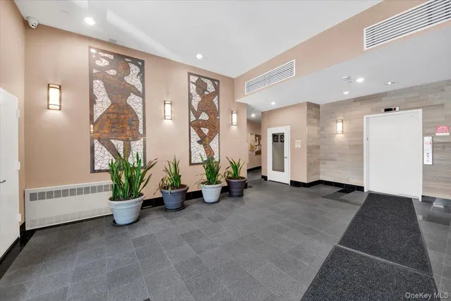 a view of a hallway with potted plants