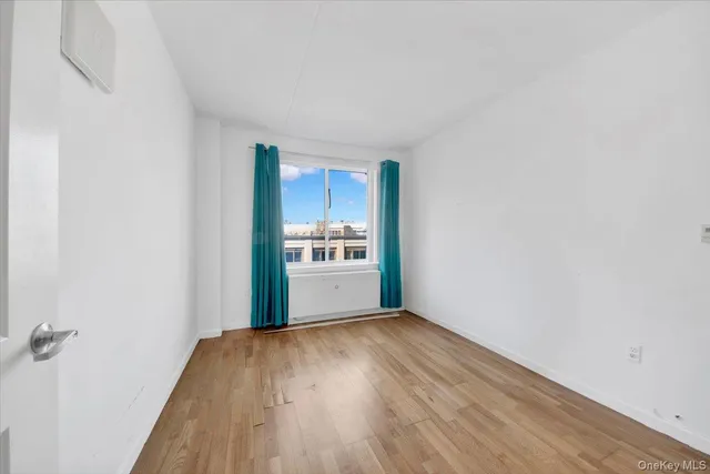 a view of a kitchen with wooden floor