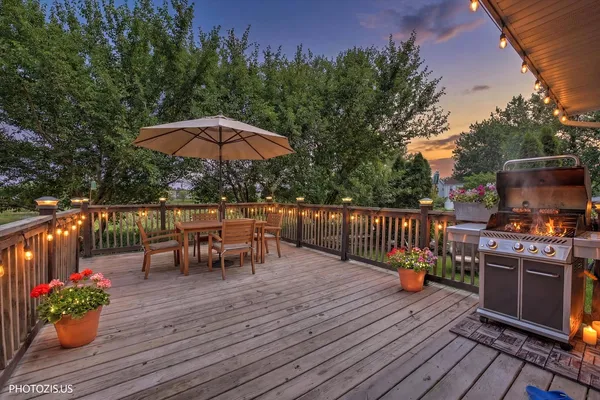 a view of a deck with a yard