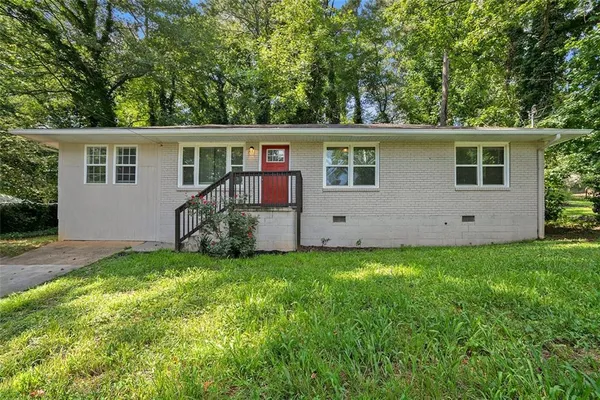 front view of a house with a yard