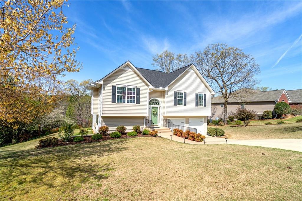 11 Seay Drive Southeast Rome, GA 30161 - Photo 1 of 1 a view of a white house with a yard covered with snow in front of house