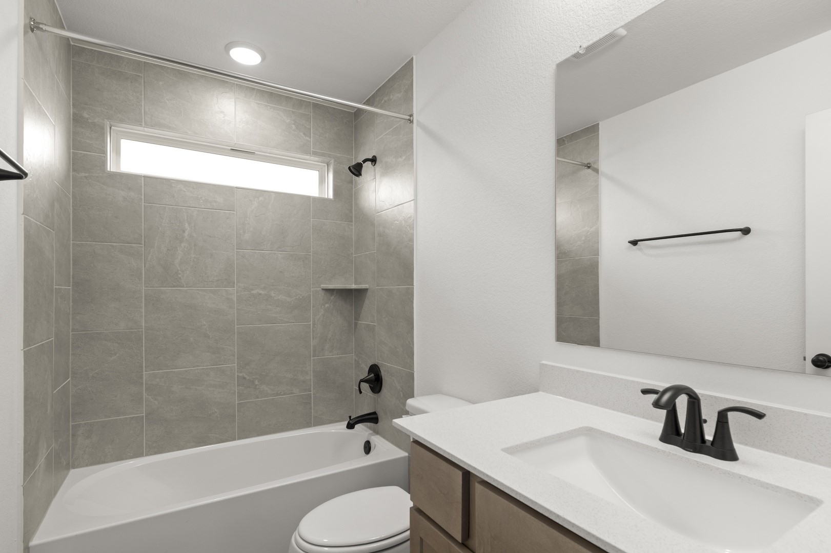 3717 Pin Oak Hills Seguin, TX 78155 - Photo 16 of 22 a bathroom with a sink toilet a shower and a bathtub