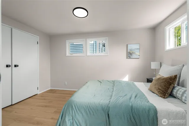 a bedroom with a bed and window