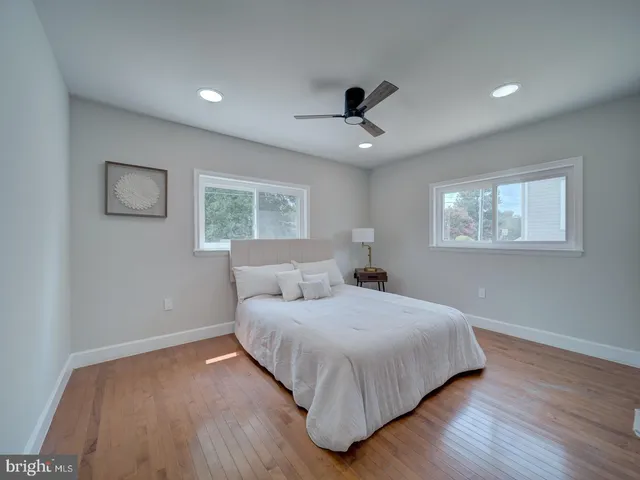 a bedroom with a bed and a lamp