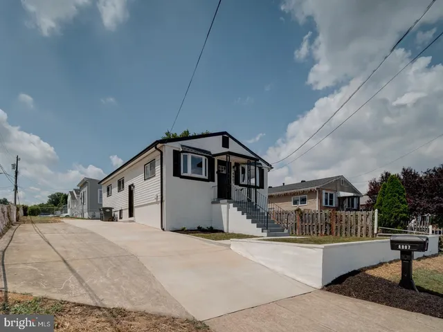 a house with trees in the background