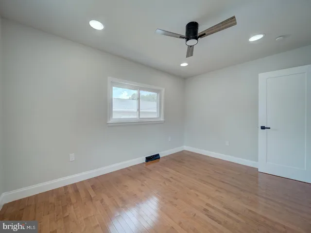 a view of a bathroom with toilet shower and a bathtub