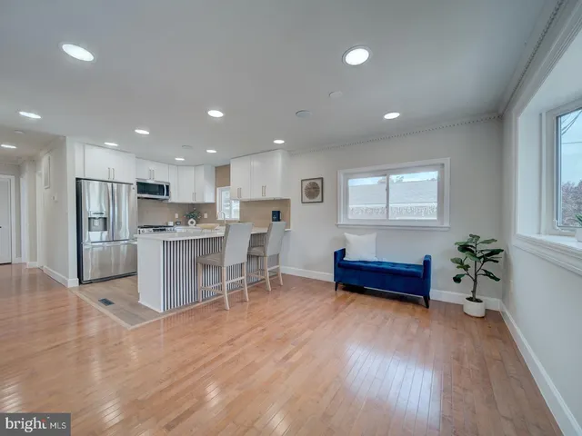 a workspace with wooden floor and furniture