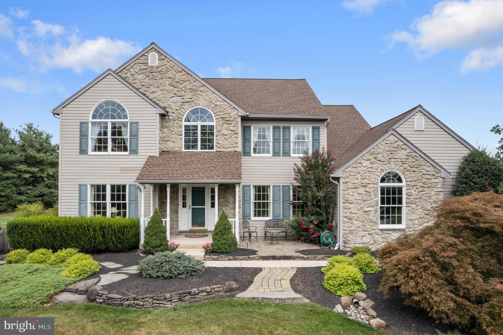 1010 Branch Mill Road Telford, PA 18969 - Photo 1 of 74 a front view of a house with a garden and yard
