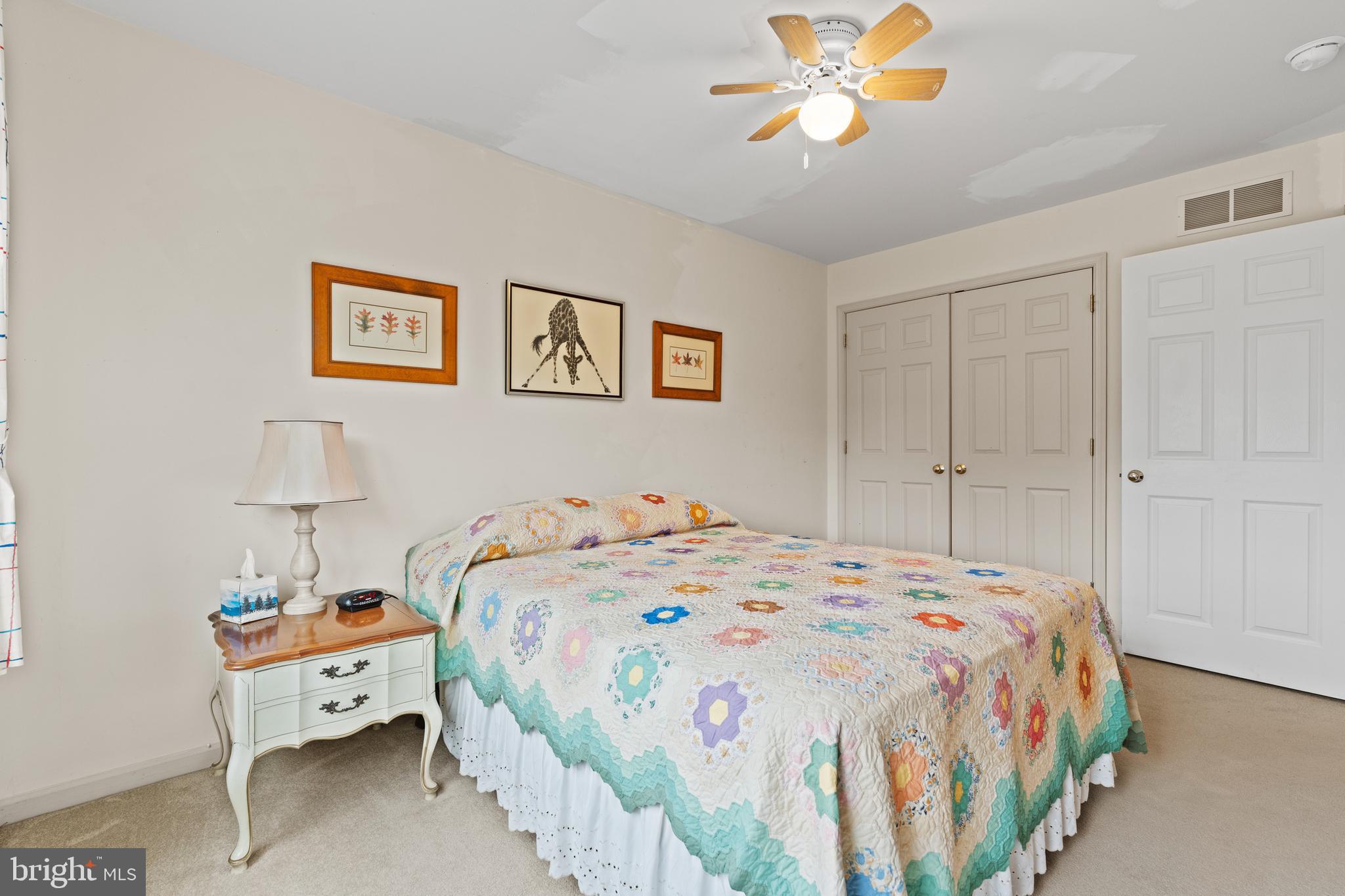 1010 Branch Mill Road Telford, PA 18969 - Photo 38 of 74 a bedroom with a bed and a chandelier