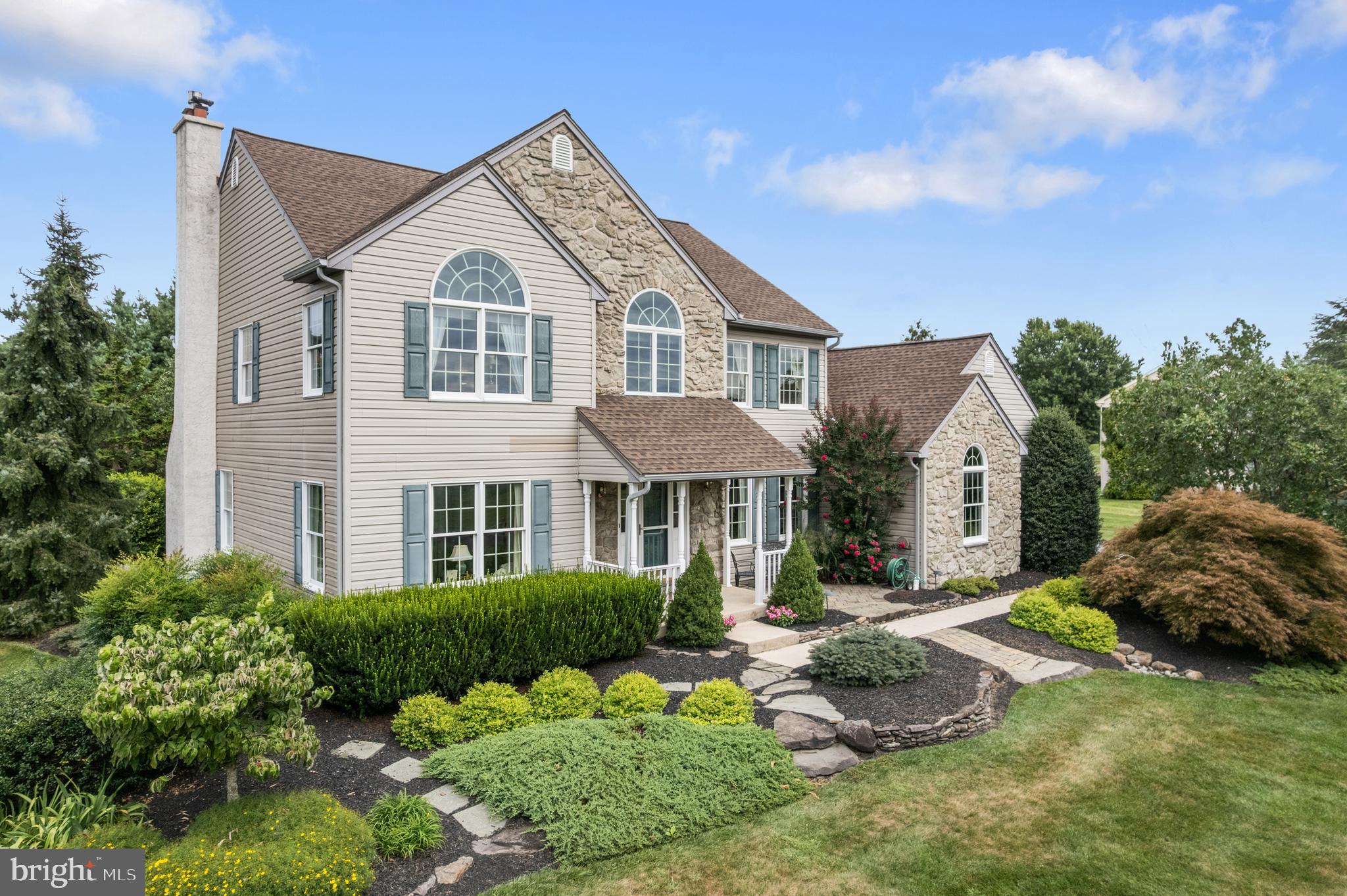 1010 Branch Mill Road Telford, PA 18969 - Photo 6 of 74 a front view of a house with a yard and garage