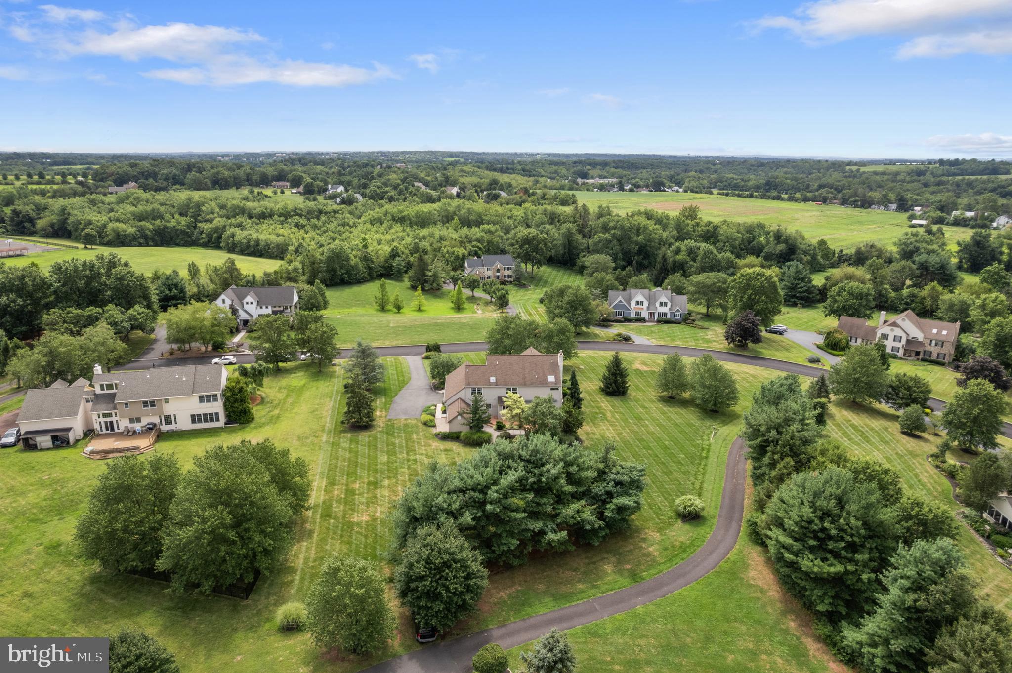 1010 Branch Mill Road Telford, PA 18969 - Photo 62 of 74 an aerial view of green landscape with trees houses and lake view