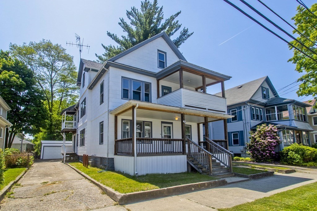 52-54 Draper Street Springfield, MA 01108 - Photo 1 of 31 a front view of a house with garden