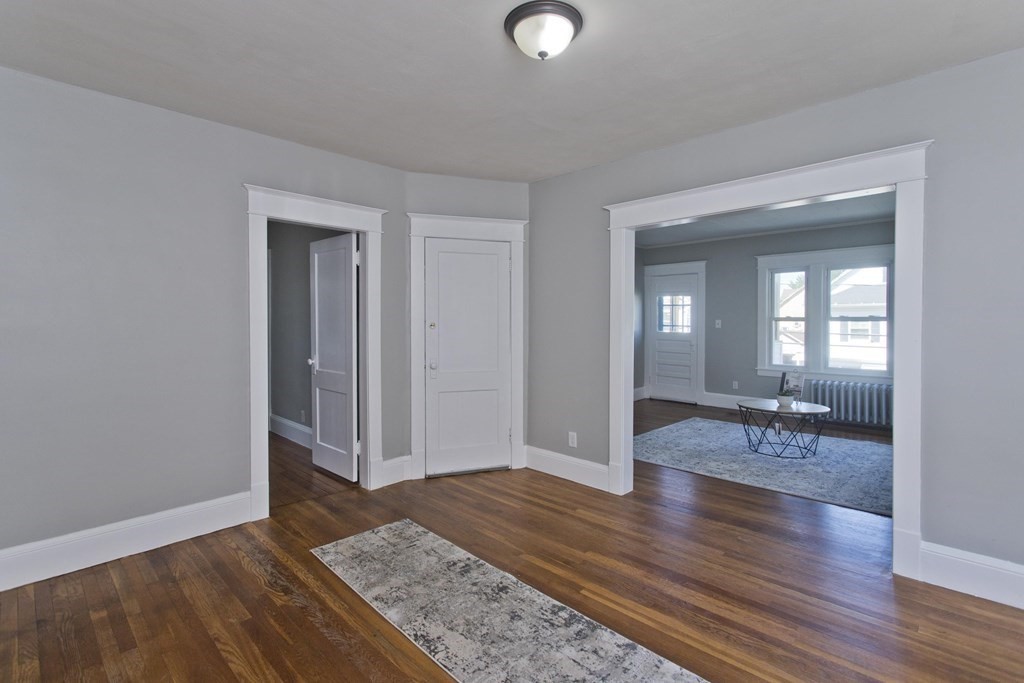 52-54 Draper Street Springfield, MA 01108 - Photo 20 of 31 a view of livingroom with hardwood floor and hallway
