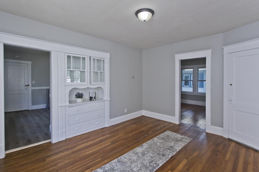 52-54 Draper Street Springfield, MA 01108 - Photo 21 of 31 wooden floor with white cabinets