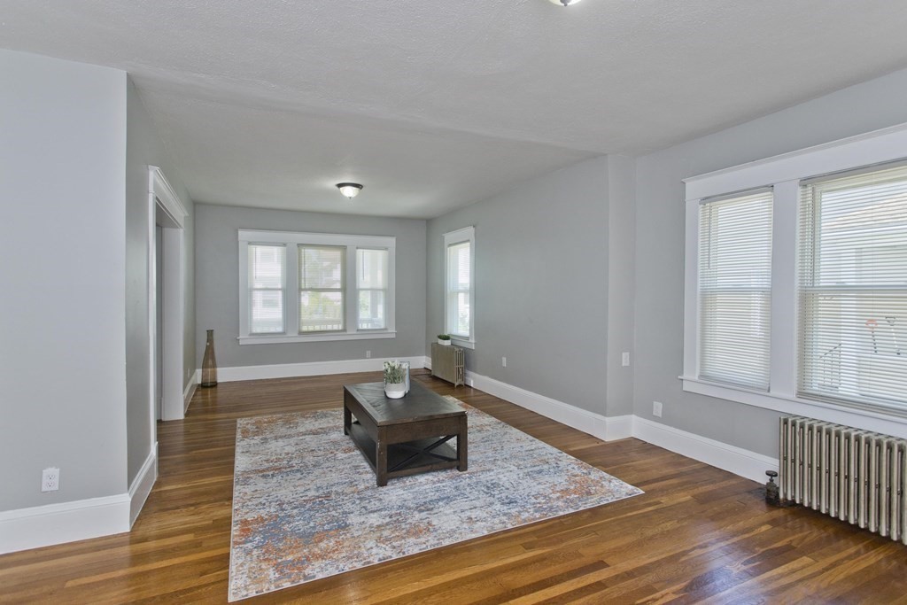 52-54 Draper Street Springfield, MA 01108 - Photo 9 of 31 a living room with furniture rug and window