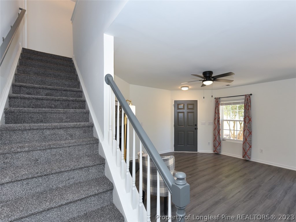 3625 Marshlane Way Raleigh, NC 27610 - Photo 16 of 37 a view of entryway and hall with wooden floor