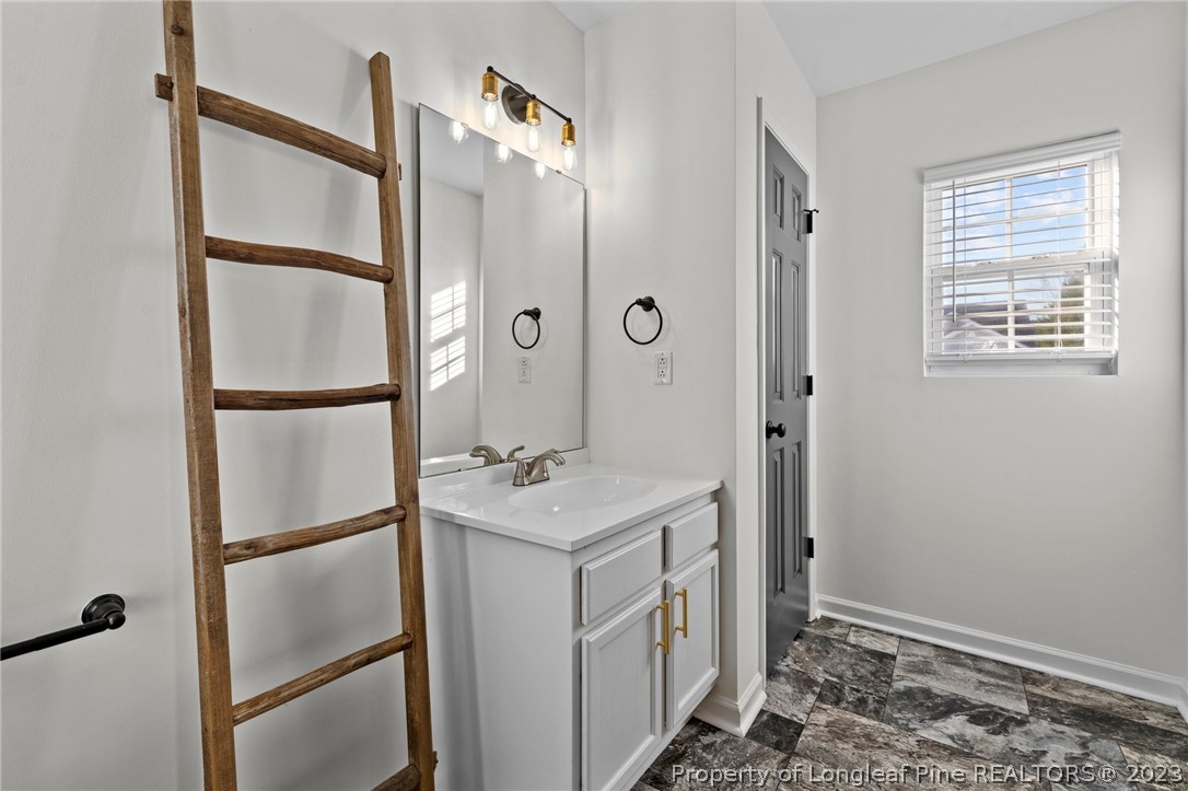 3625 Marshlane Way Raleigh, NC 27610 - Photo 19 of 37 a bathroom with a shower and a sink