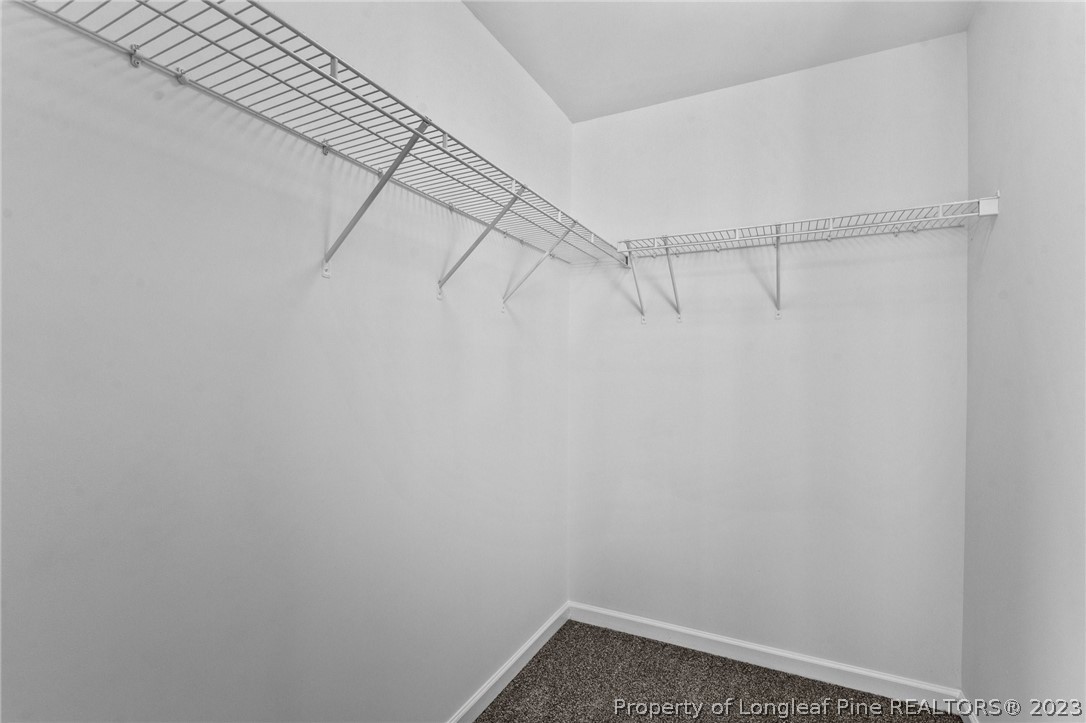 3625 Marshlane Way Raleigh, NC 27610 - Photo 21 of 37 a view of a room with racks on the wall