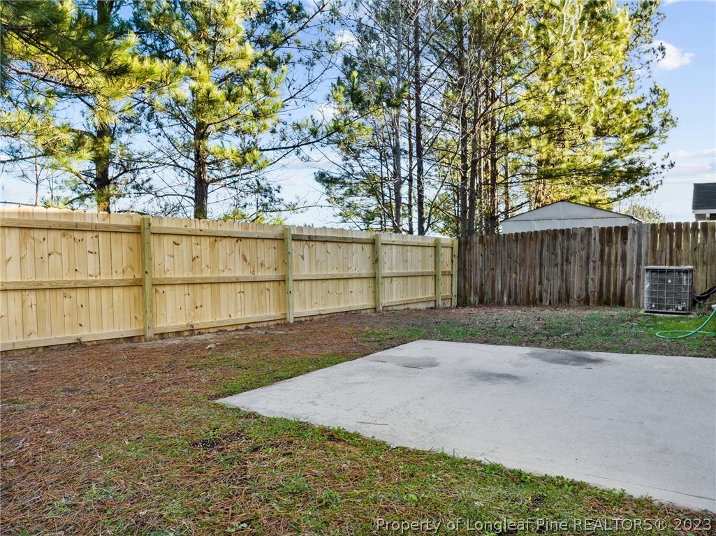 3625 Marshlane Way Raleigh, NC 27610 - Photo 32 of 37 a view of backyard with wooden fence
