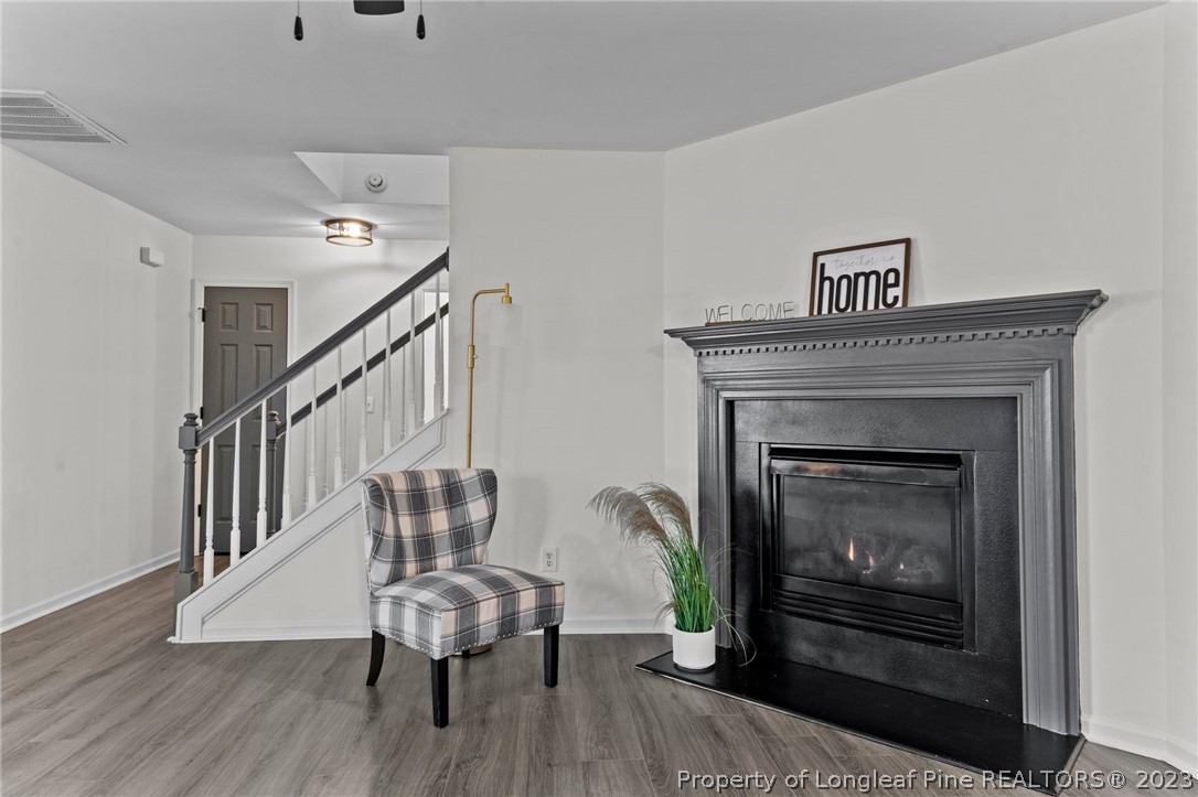 3625 Marshlane Way Raleigh, NC 27610 - Photo 4 of 37 a living room with furniture and a fireplace