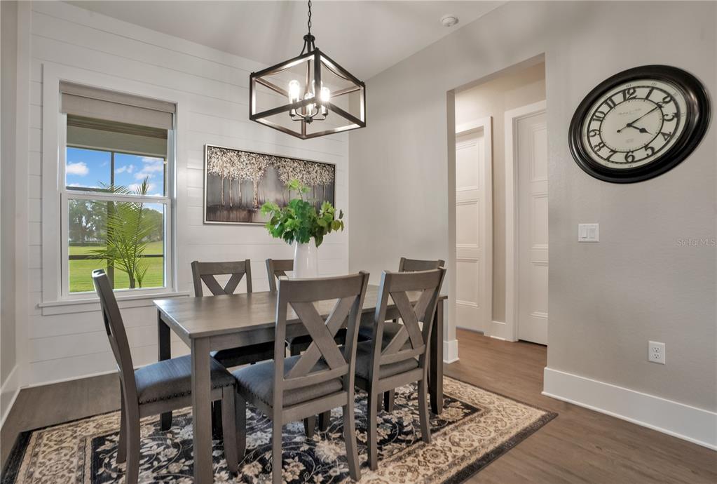 440 Palma Ceia Road Winter Haven, FL 33884 - Photo 17 of 78 a view of a dining room with furniture window and wooden floor