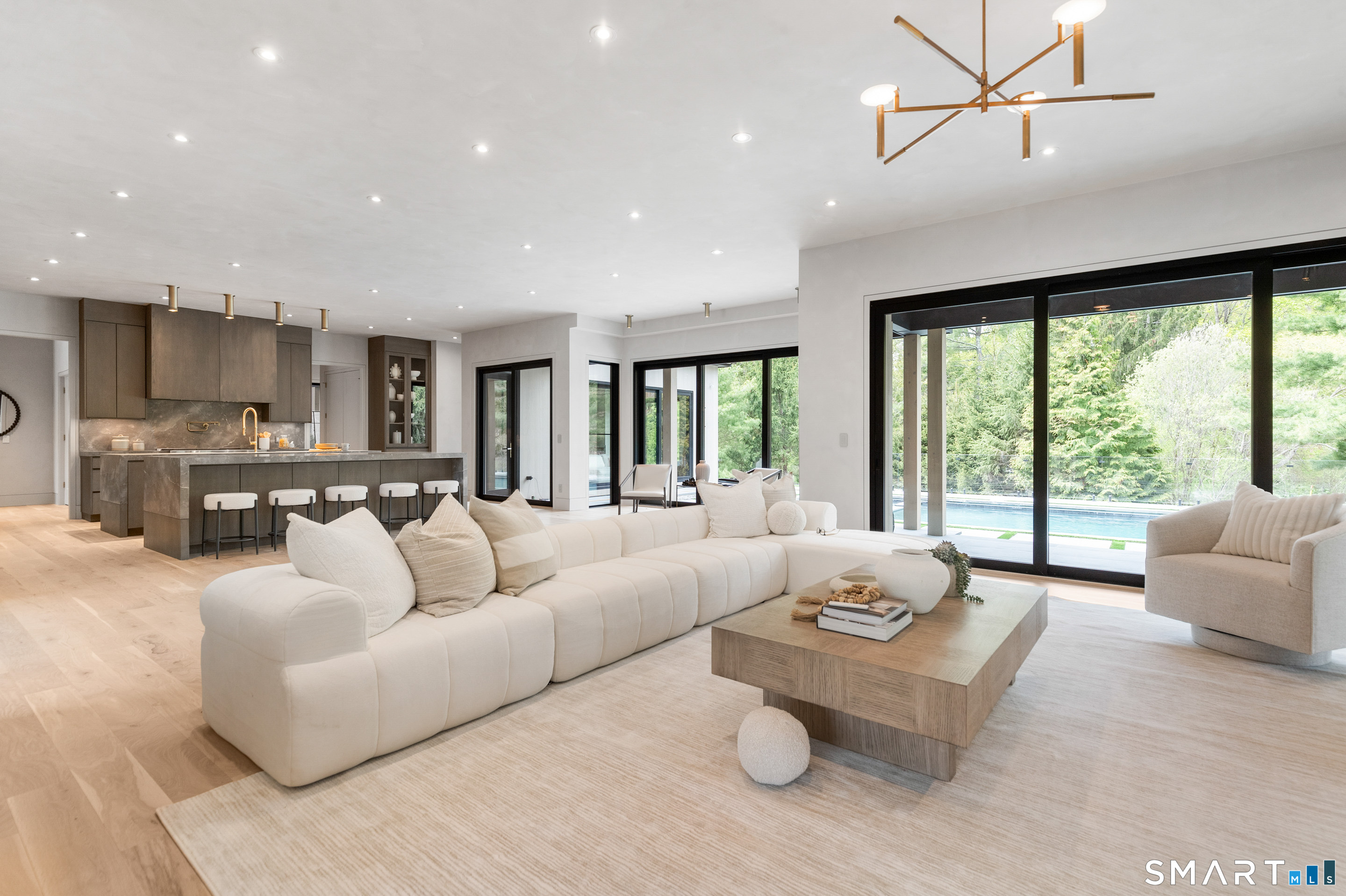 259 Frogtown Road New Canaan, CT 06840 - Photo 14 of 39 a living room with furniture and a large window