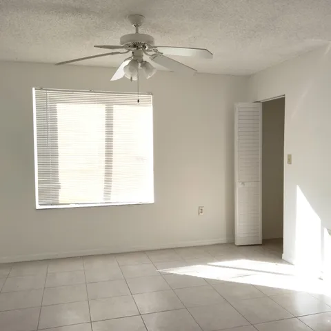 a view of an empty room with a window