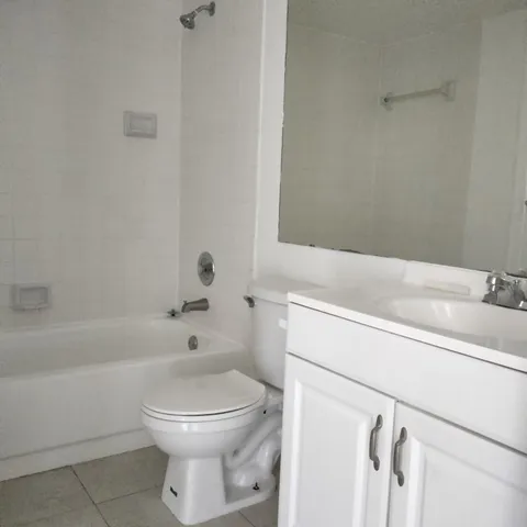 a bathroom with a toilet sink and bathtub