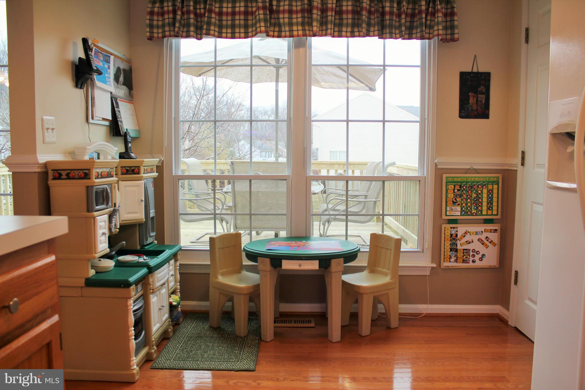 8850 Fox Circle Perry Hall, MD 21128 - Photo 13 of 30 a dining room with furniture and wooden floor