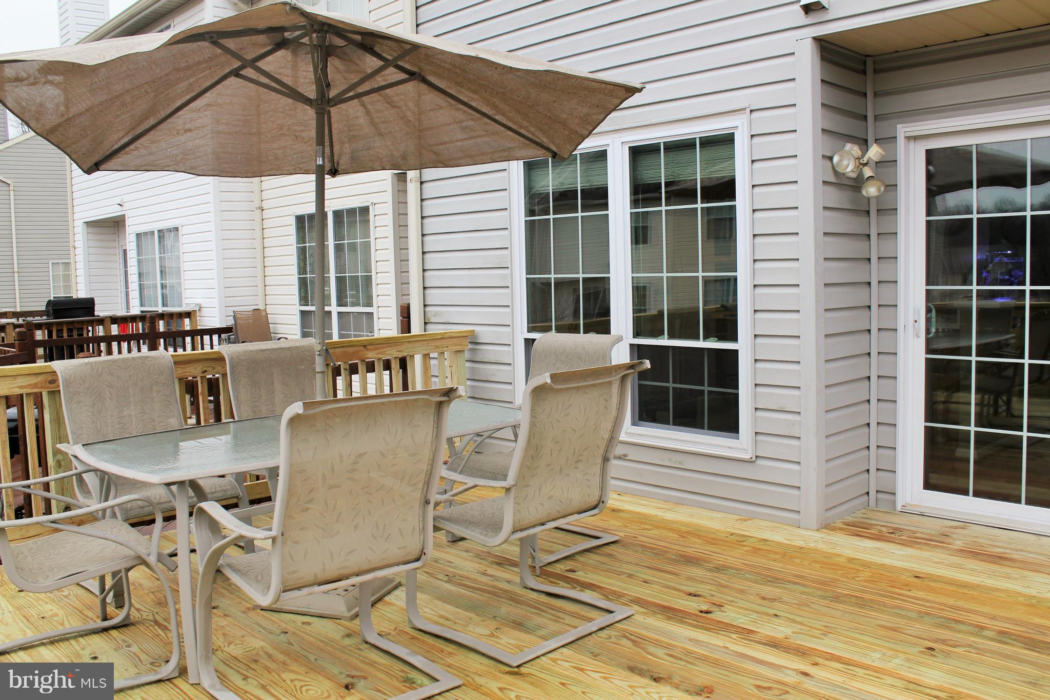 8850 Fox Circle Perry Hall, MD 21128 - Photo 14 of 30 a view of a patio with table and chairs under an umbrella