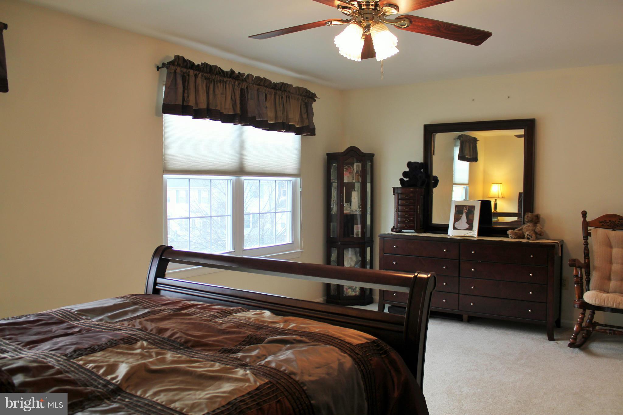 8850 Fox Circle Perry Hall, MD 21128 - Photo 16 of 30 a bedroom with a bed and a mirror on dresser