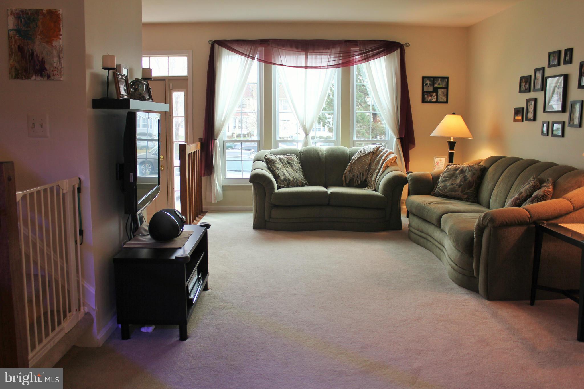 8850 Fox Circle Perry Hall, MD 21128 - Photo 8 of 30 a living room with furniture and a large window