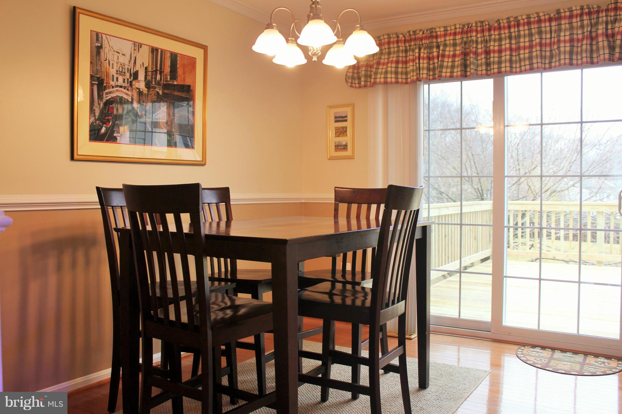 8850 Fox Circle Perry Hall, MD 21128 - Photo 9 of 30 a view of a dining room with furniture and a large window