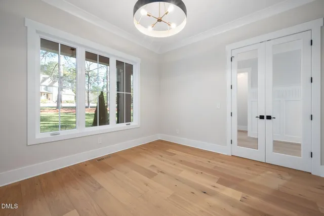 a view of an entryway with wooden floor