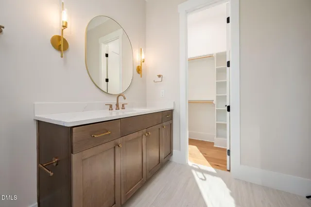 a kitchen with white cabinets and appliances