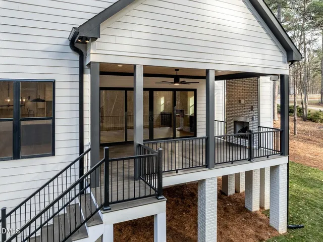 a kitchen with stainless steel appliances granite countertop a sink a stove and a wooden floors