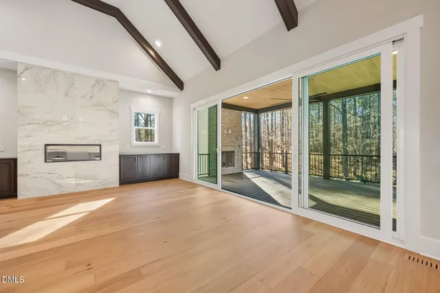 a spacious bathroom with a sink and a mirror