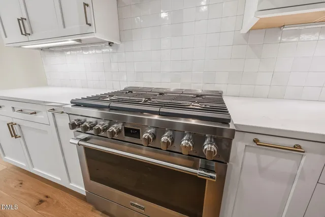 an aerial view of a house with a garden and swimming pool