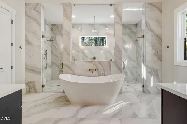 an empty room with windows and entryway