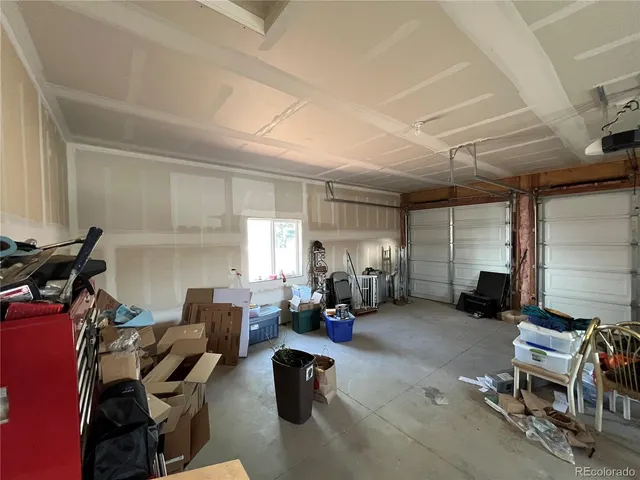 a living room with furniture gym equipment and a fireplace