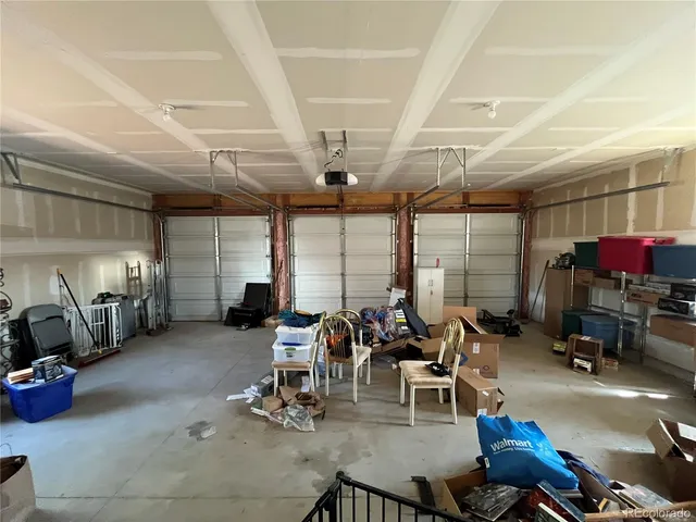 a living room with lots of furniture and gym equipment