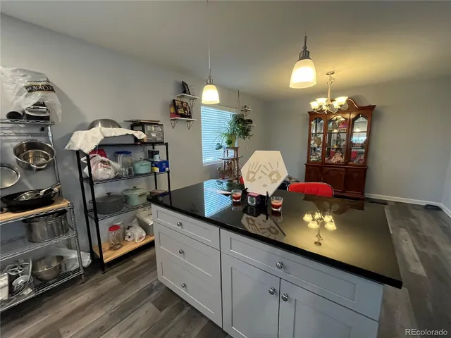 a kitchen with sink and cabinets