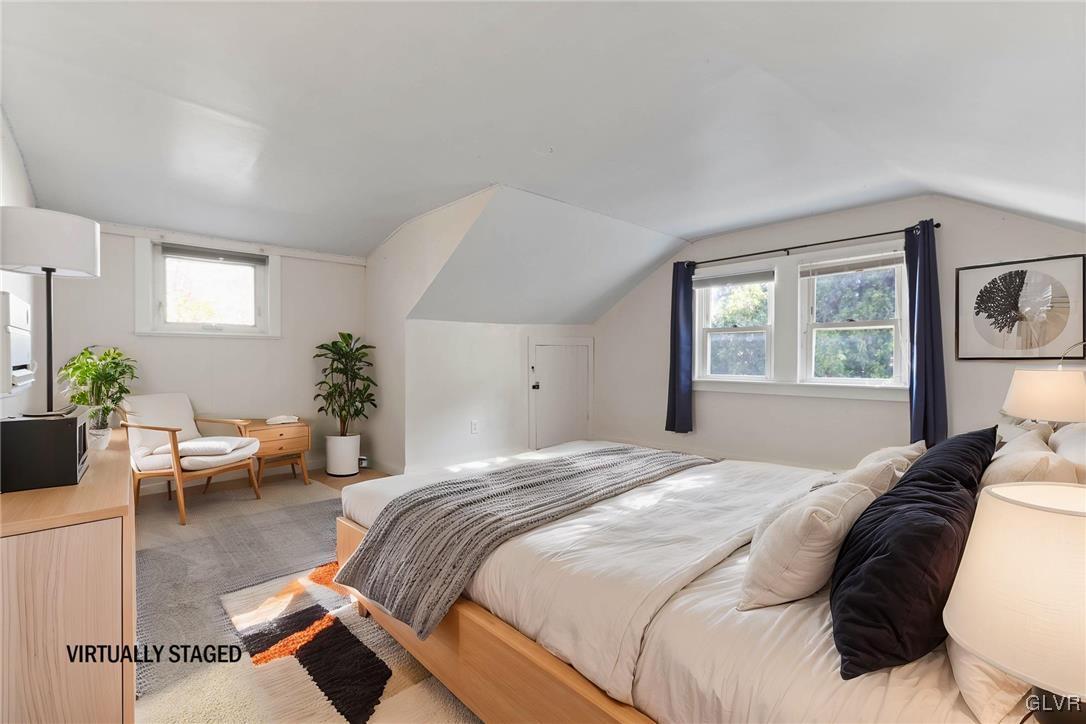 1802 Moselem Spring Road Hamburg, PA 19526 - Photo 27 of 54 a bedroom with a large bed and potted plant with two window