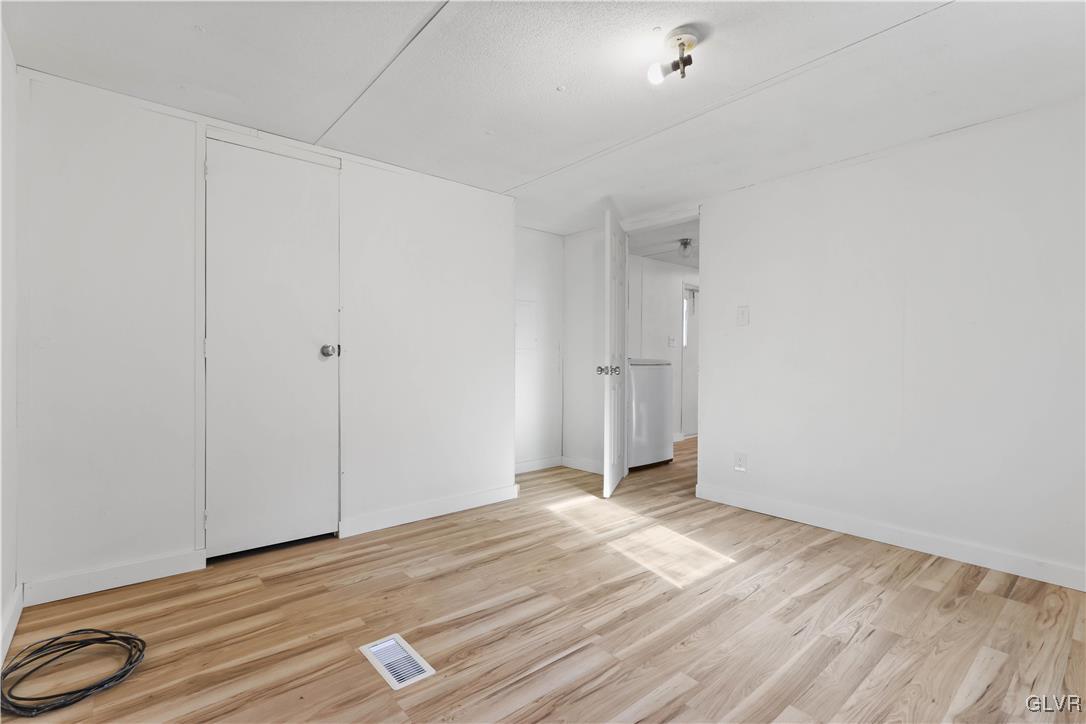 1802 Moselem Spring Road Hamburg, PA 19526 - Photo 40 of 54 a view of a room with wooden floor and white walls