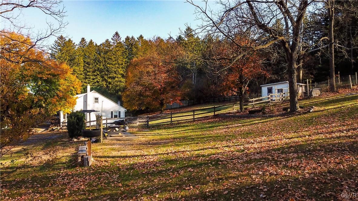 1802 Moselem Spring Road Hamburg, PA 19526 - Photo 4 of 54 a view of a town with large trees and a small barn