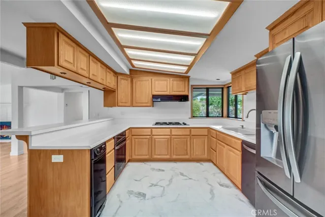 a bathroom with a sink a mirror and a shower