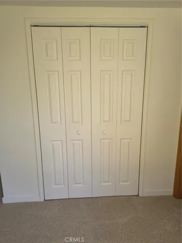 a city view with lots of trees in the background