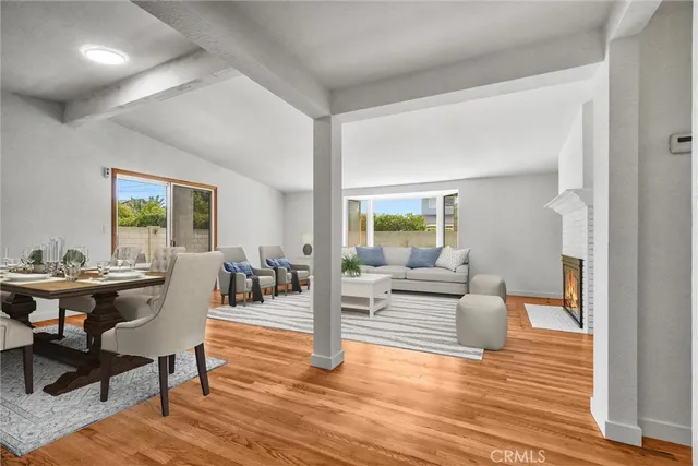 a kitchen with stainless steel appliances granite countertop a sink a refrigerator and a stove