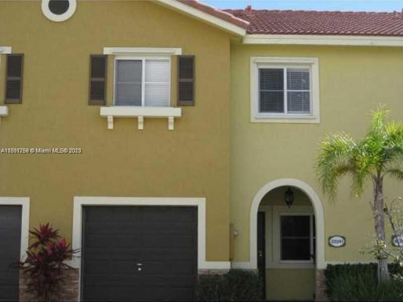 22241 Southwest 88th Path Cutler Bay, FL 33190 - Photo 9 of 9 a front view of a house with plants