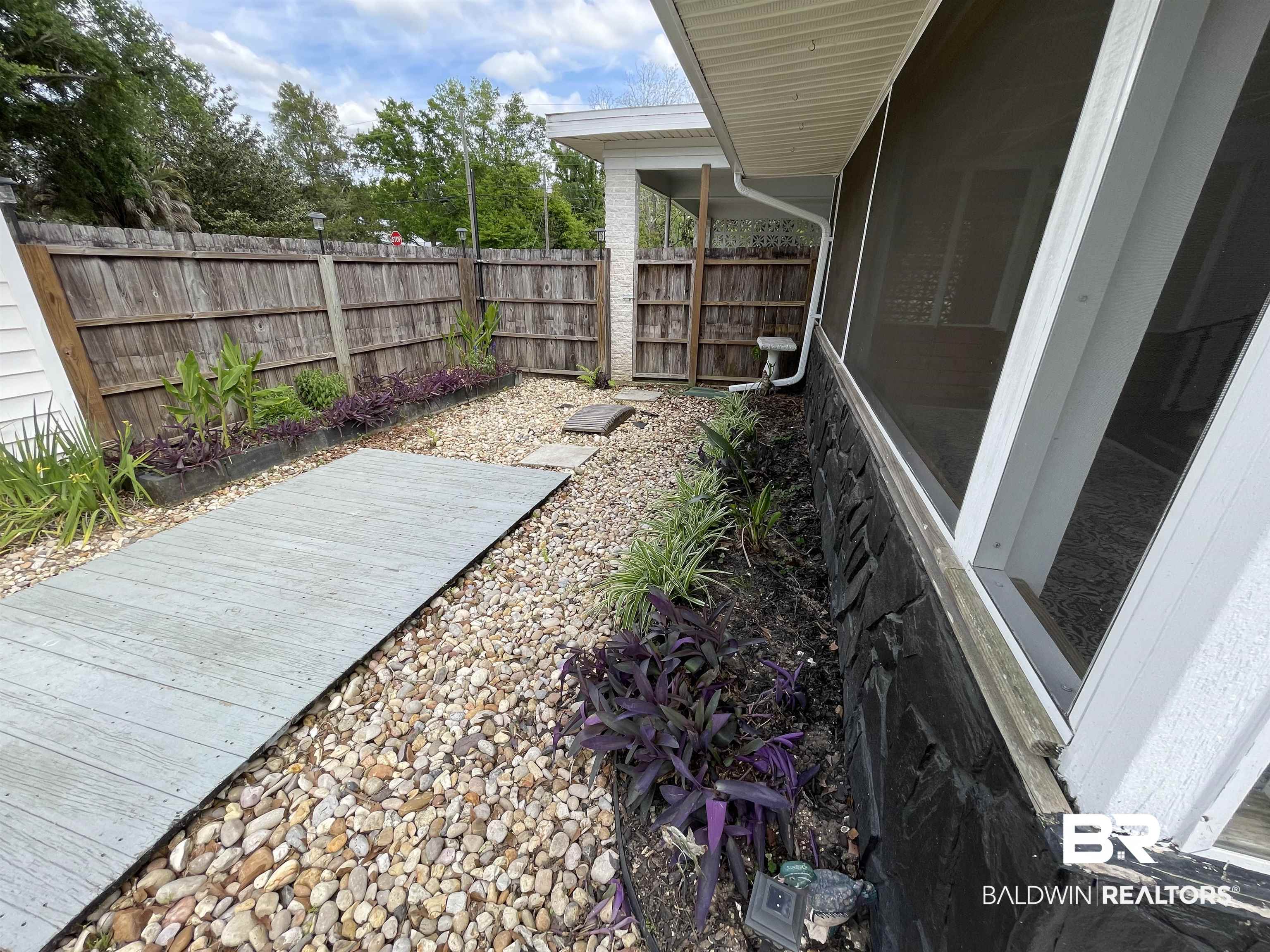402 West Myrtle Avenue Foley, AL 36535 - Photo 6 of 38 Garden Area outside of screen porch